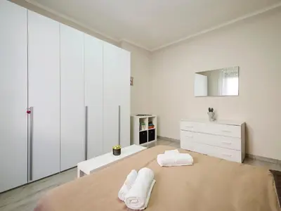 Letto o letti in una camera di Lungastretta Apartment - Cremona Center