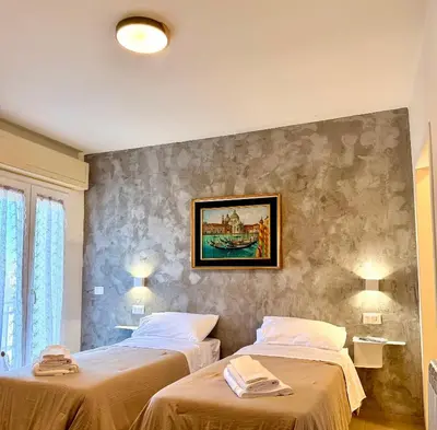 Letto o letti in una camera di B&B Il GLICINE