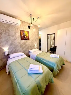 Letto o letti in una camera di B&B Il GLICINE