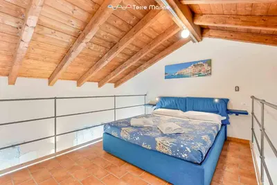 Letto o letti in una camera di Ponente, TerreMarine