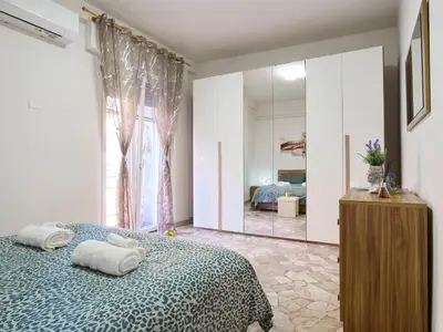 Letto o letti in una camera di Dante Apartment - Cremona Center