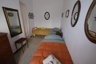 Letto o letti in una camera di Le Rane Abbronzate by PortofinoVacanze