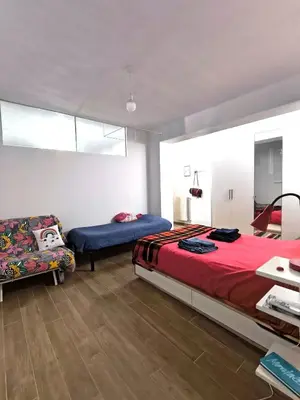 Letto o letti in una camera di B&B La Tana del Bianconiglio