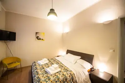 Letto o letti in una camera di Aurea Living Parma Family & Business Parcheggio