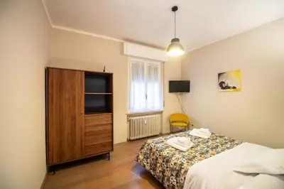 Letto o letti in una camera di Aurea Living Parma Family & Business Parcheggio