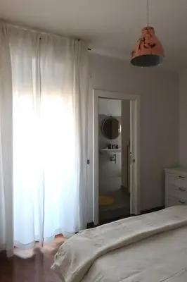 Letto o letti in una camera di Loft Claretta - Modena City