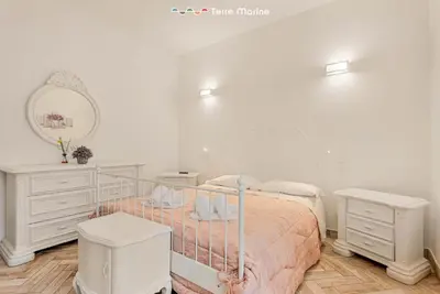 Letto o letti in una camera di La Corte dei ValEmi 2-3, TerreMarine