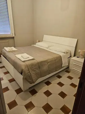 Letto o letti in una camera di Appartamento vicino lo stadio con garage
