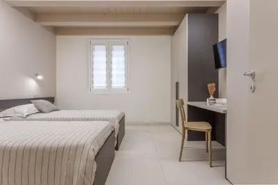Letto o letti in una camera di Modena Historic Center - Elegant Family Apartment