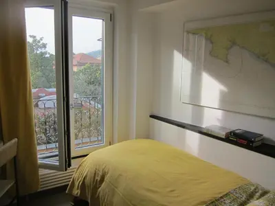 Letto o letti in una camera di Caruggio 49 Attico con parcheggio Sestri Levante