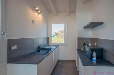 Cucina o angolo cottura di FuoriPorta Affitti Brevi - Casa dei Salici 02