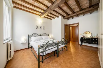 Letto o letti in una camera di Centro Storico - Eleganza rustica in città