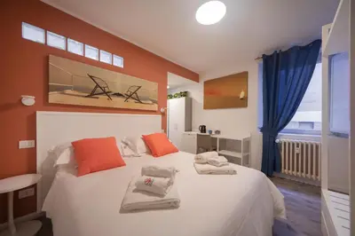Letto o letti in una camera di Casa Corallina Parma