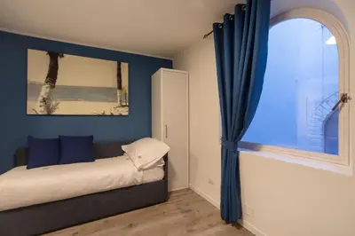 Letto o letti in una camera di Casa Corallina Parma