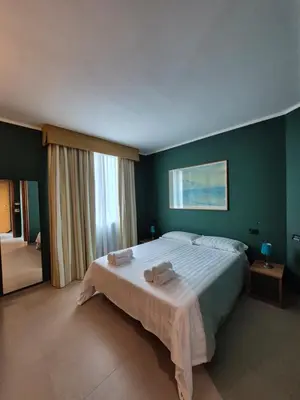Letto o letti in una camera di GARDEN HOTEL - Praticello di Gattatico - Terre di Canossa