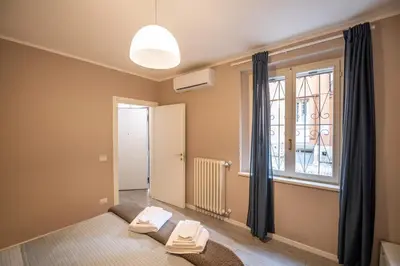 Letto o letti in una camera di Casa Leonardo