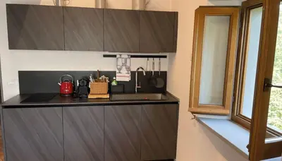 Cucina o angolo cottura di Le Stanze- apt for up to 4 pax with shared pool