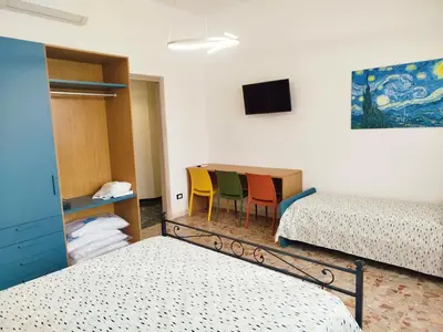 Letto o letti in una camera di VILLA All'ombra del Cedro