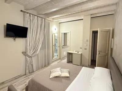Letto o letti in una camera di Hotel La Valle