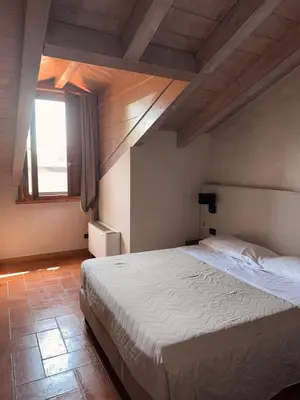 Letto o letti in una camera di Hotel La Valle
