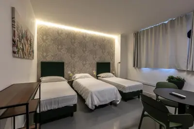 Letto o letti in una camera di Foresteria SMART ROOMS