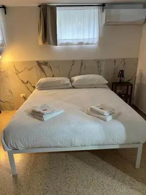 Letto o letti in una camera di da Melina