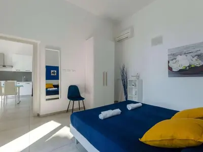 Letto o letti in una camera di Apartment Wohnung mit Meerblick und privater Garage by Interhome