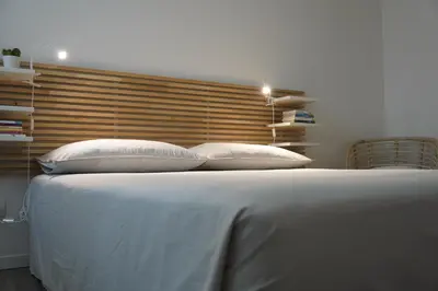 Letto o letti in una camera di Appartamento Corte dei magazzini