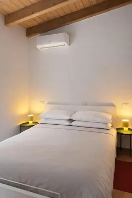 Letto o letti in una camera di Dimora Farnese