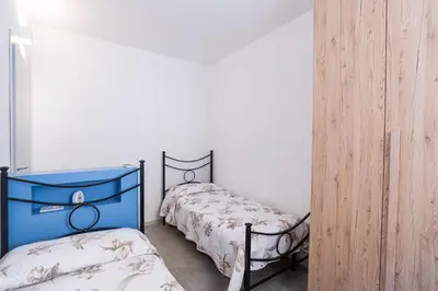 Letto o letti in una camera di appartamento San Michele