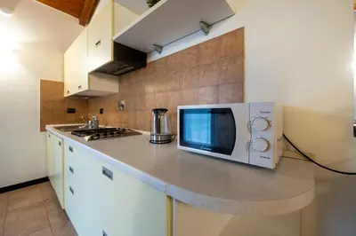 Cucina o angolo cottura di 337 - Residence Montebello Monolocale E, Relax con Piscina e Giardino