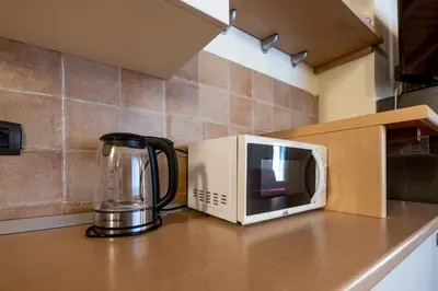 Cucina o angolo cottura di 333 - Residence Montebello Bilocale A, Relax nel verde con Piscina