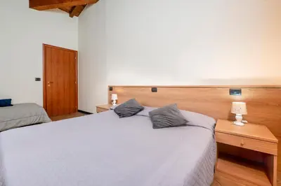 Letto o letti in una camera di 333 - Residence Montebello Bilocale A, Relax nel verde con Piscina