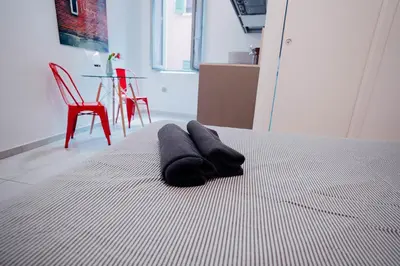 Letto o letti in una camera di 2D - Home 32 Apartments