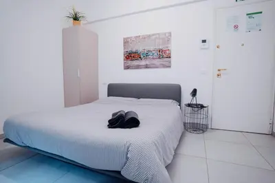 Letto o letti in una camera di 2D - Home 32 Apartments