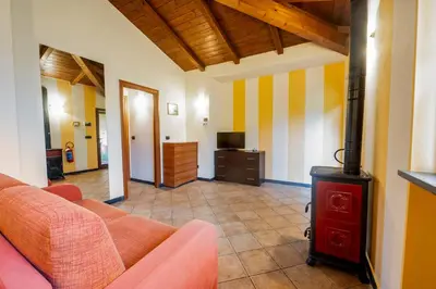Area soggiorno di 334 - Residence Montebello Bilocale B, Relax nel verde con Piscina