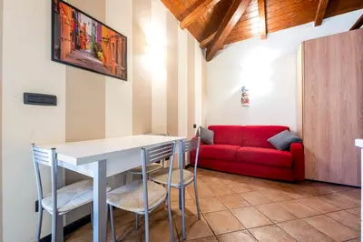 Area soggiorno di 335 - Residence Montebello Monolocale C, Relax nel verde con Piscina