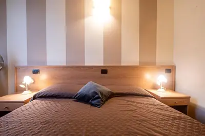 Letto o letti in una camera di 335 - Residence Montebello Monolocale C, Relax nel verde con Piscina
