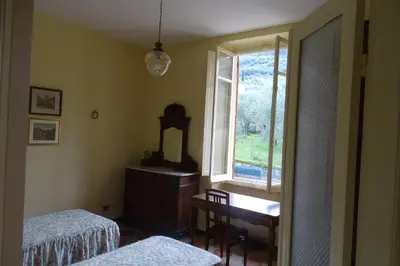Letto o letti in una camera di Villa Rosa primo piano