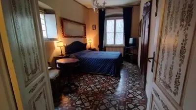 Letto o letti in una camera di DIMORA della TORRE a due passi dal mare