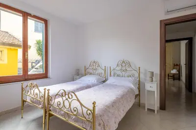 Letto o letti in una camera di Appartamento Roberto-4 beds,AC