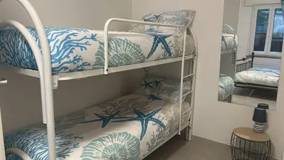 Letto o letti in una camera di Casa Conchiglia 6 ospiti 10 min mare e centro