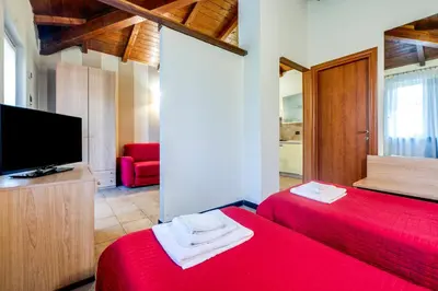 Letto o letti in una camera di 336 - Residence Montebello Monolocale D, Relax nel verde con Piscina