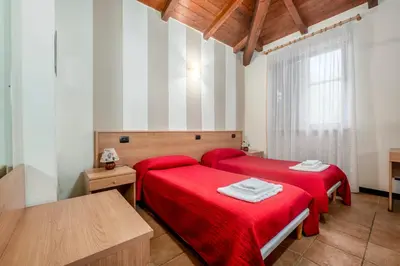 Letto o letti in una camera di 336 - Residence Montebello Monolocale D, Relax nel verde con Piscina