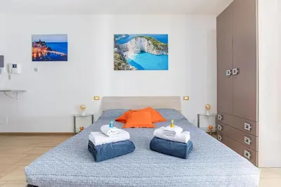 Letto o letti in una camera di Orizzonte 5 Terre - Via Lunigiana 221 - Stazione Migliarina, interno 18