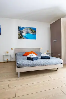 Letto o letti in una camera di Orizzonte 5 Terre - Via Lunigiana 221 - Stazione Migliarina, interno 18