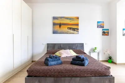 Letto o letti in una camera di Orizzonte 5 Terre - Via Lunigiana 221 - Stazione Migliarina, Interno 19