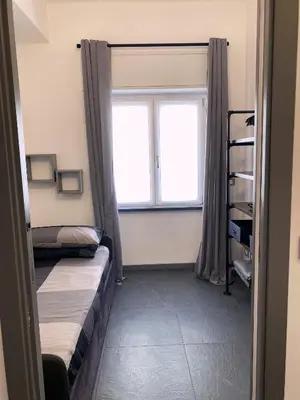 Letto o letti in una camera di Trilocale Santa Caterina - Silent Bay Apartments