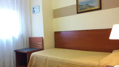 Letto o letti in una camera di Hotel Due Fontane