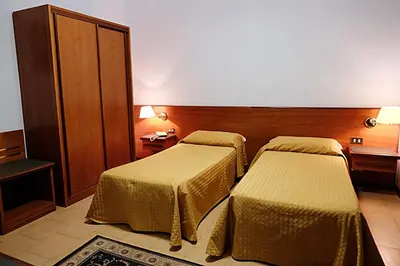 Letto o letti in una camera di Hotel Due Fontane